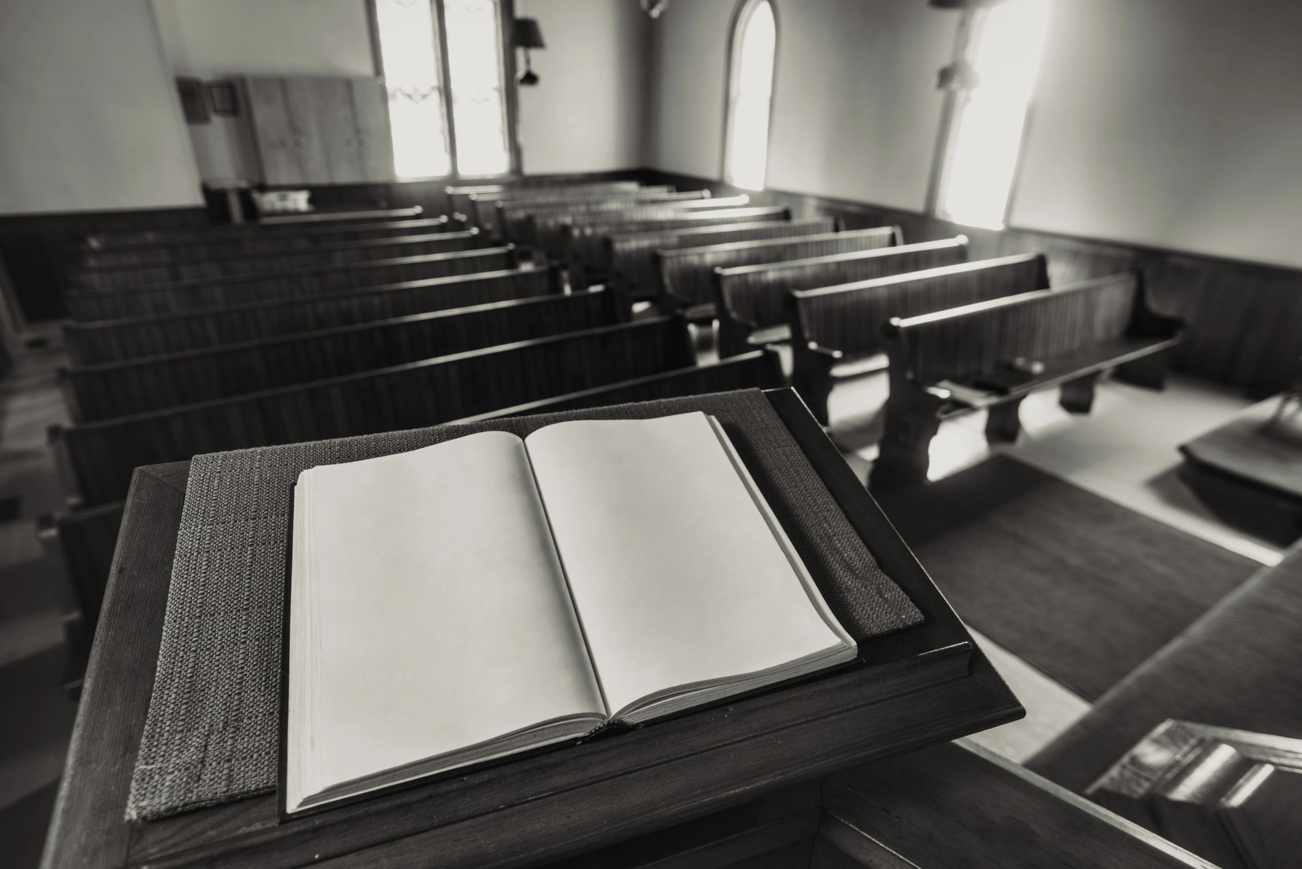 Open Bible on a stand in a quiet church