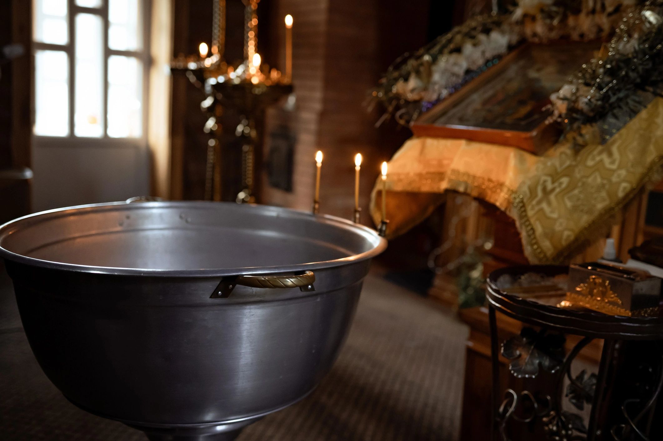 Candles and icon stand in an Orthodox church interior