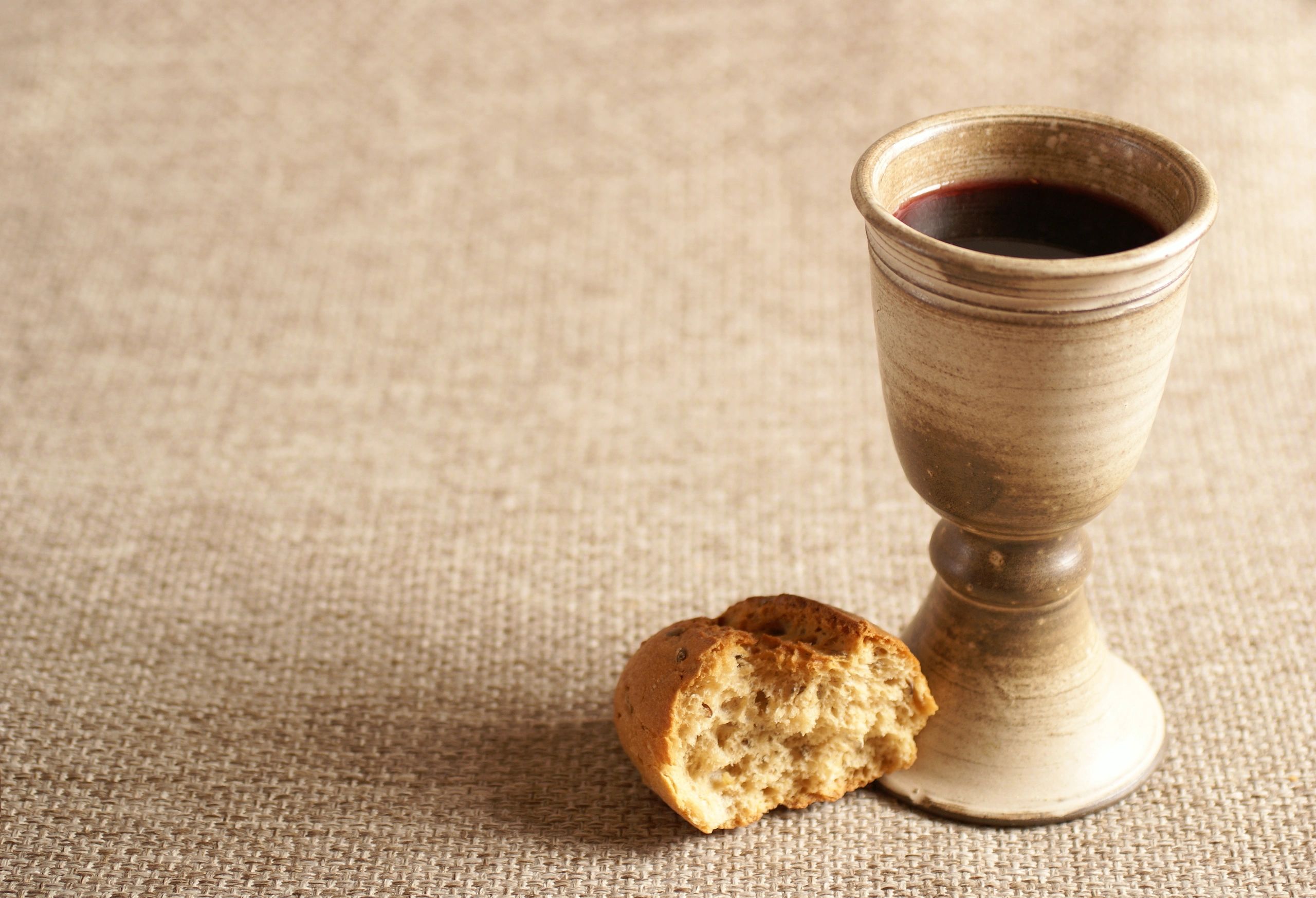 Chalice and bread on a table